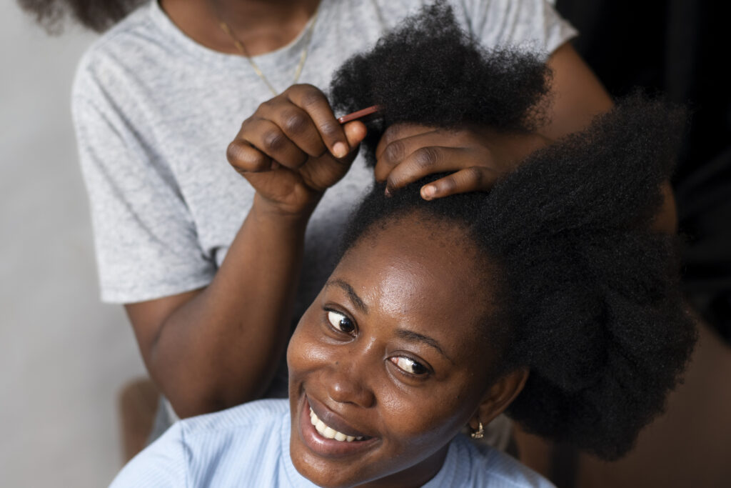 stylist-woman-taking-care-her-client-afro-hair